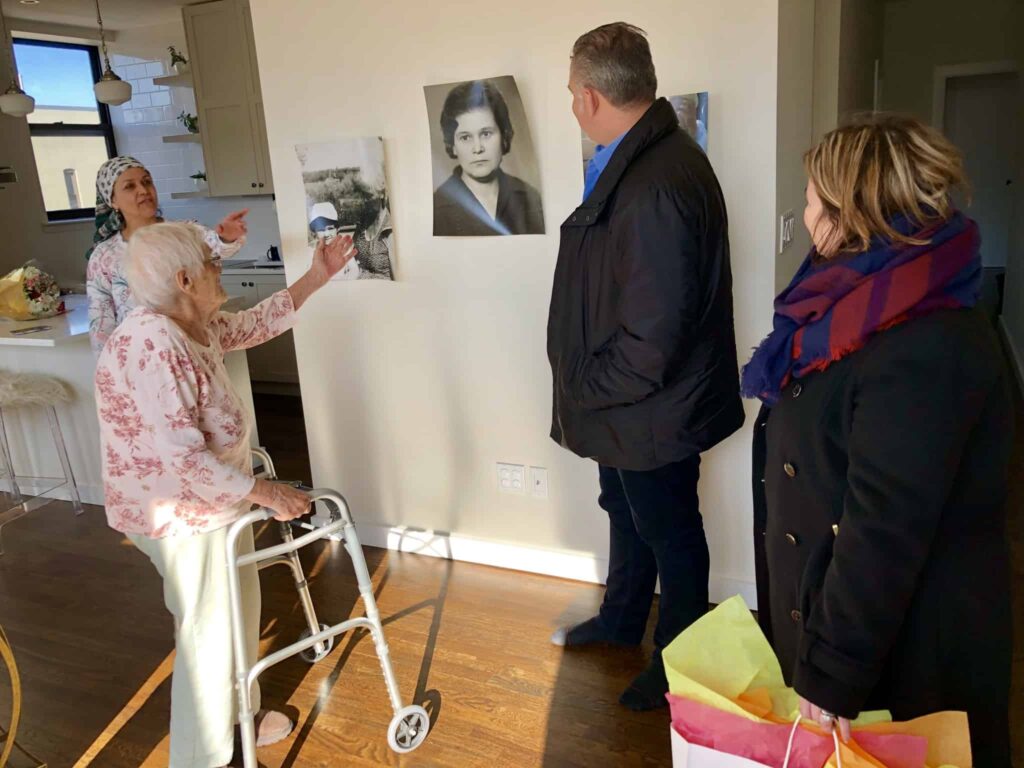 yevgeniya pointing at her portrait as a young girl